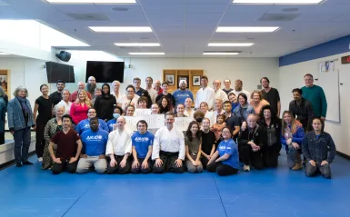 Group photo of aikido students at the Aikido 15th Anniversary in 2023 inside their training space.