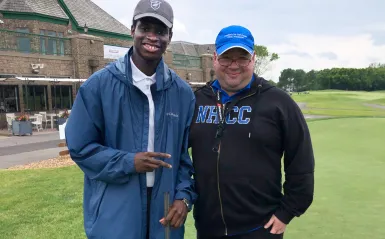 Student Senate President and NHCC President Rolando Garcia on putting green