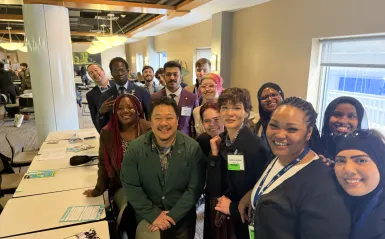 this is a photo of a group of students and a local legislator, smiling for the camera inside the Minnesota Capitol building on Advocacy Day 2026. 