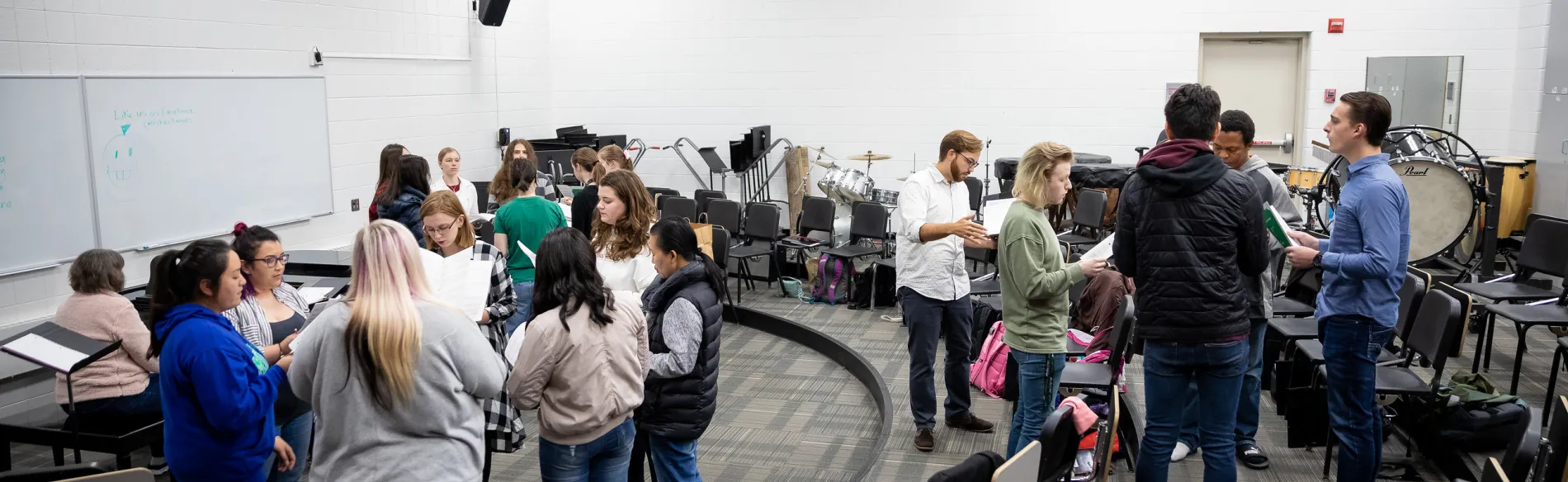 student singing in groups at choir class 