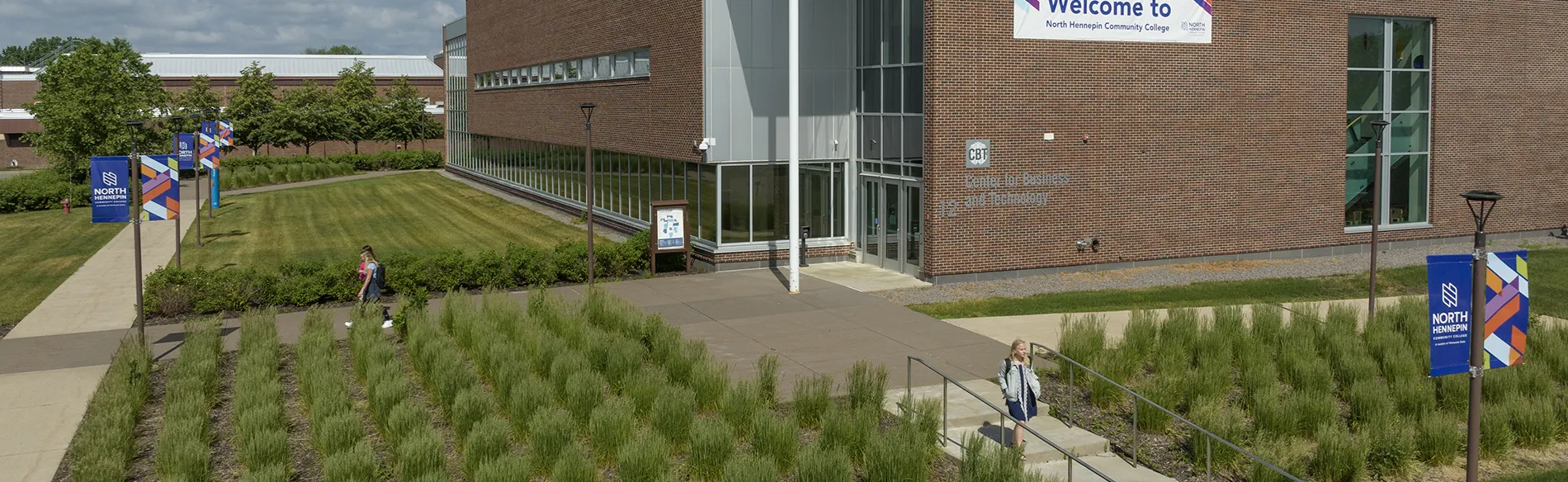 drone view of the campus building with students walking