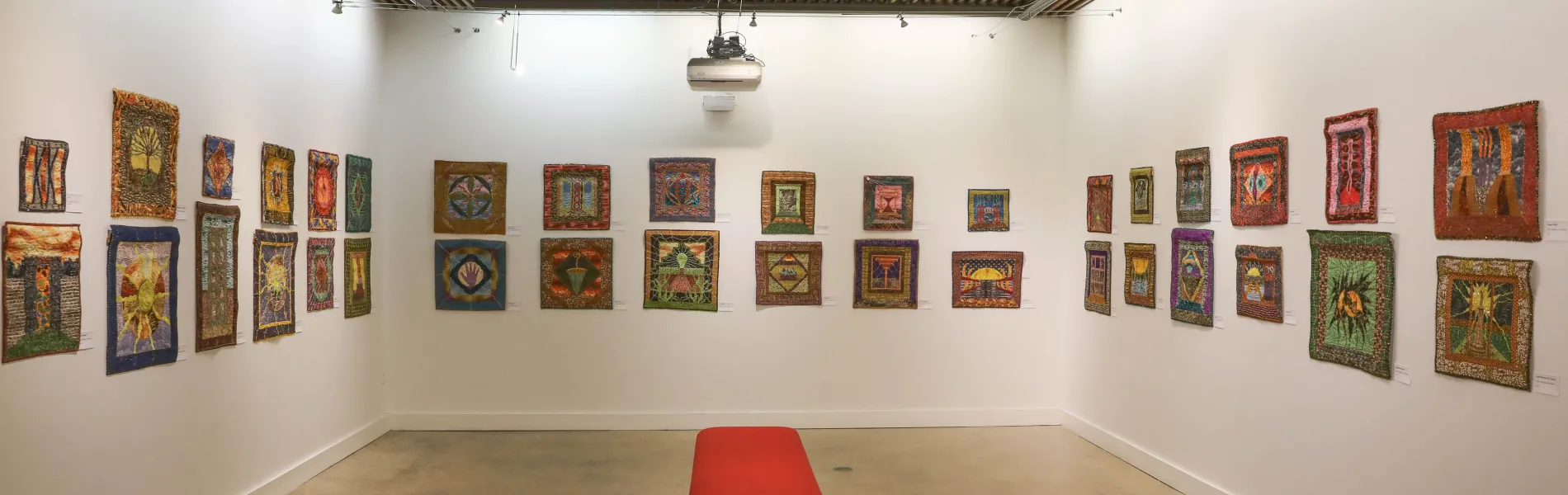 an art gallery with colorful art on the walls