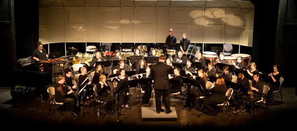 concert band musicians performing on stage