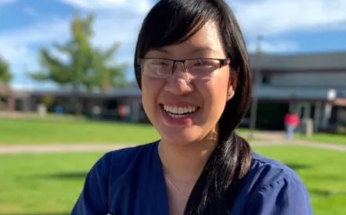 student Jessica Nguyen standing outside smiling