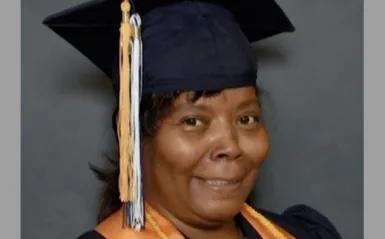 alumni Deb Fortney posing for her graduation phot 