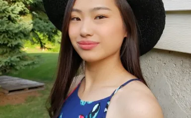 STEM Student Christina Yang standing outside smiling at the camera