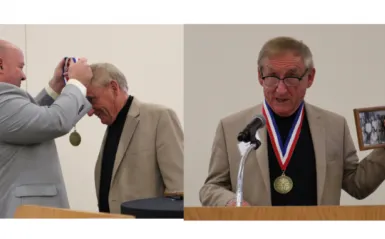 Photo of Dr. Garcia presenting the 2021 Medallion award