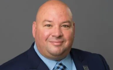 man in a nice suit smiling 