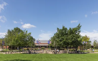 students sitting outside on a sunny day