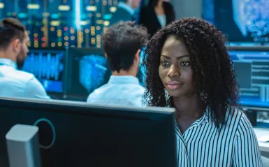 photo of a female working on a computer 