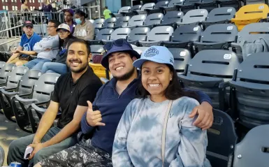 a group of NHCC alumni and friends at the Saints baseball game.  