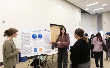 psychology students presenting at the NHCC+ event