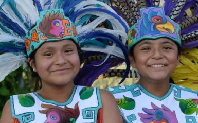 a photo of girls smiling from a Hispanic Heritage Month event flyer