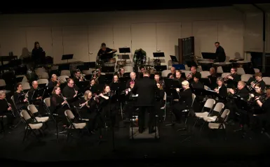 Concert photo of Dave conducting. 
