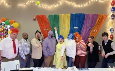 a photo of the CARE Center staff at NHCC dressed for Halloween as characters from the Pixel Inside Out 2 movie. 