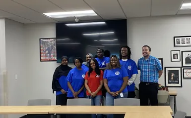 a photo of the Fall 2024 Student Senate group smiling for a photo in the Campus Center. 