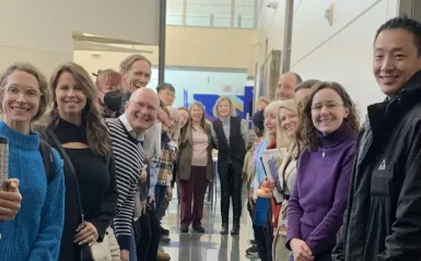 a photo of faculty posing for a picture at the January 2025 Duty Day. 
