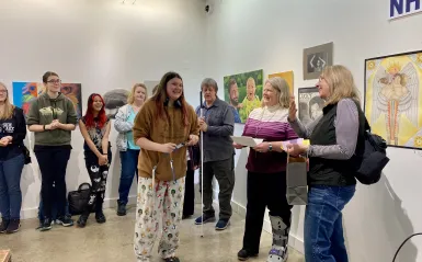 this is a photo of the crowd of students, faculty, dean and special guests in the Art Gallery during the Student Art Show Awards Reception. 