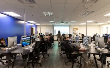 students at a computers in a classroom 