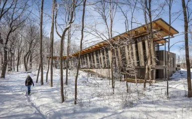 this is a photo of the Eastman Nature Center exterior taken during winter with snow on the ground. Photo credit from Minneapolis Northwest Tourism. 