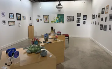 this is a photo of the NHCC Art Gallery with student art on the walls. 