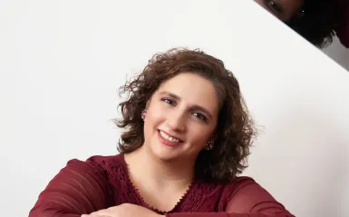 this is a headshot photo of a female jazz composer named, Kristin Sponcia. 