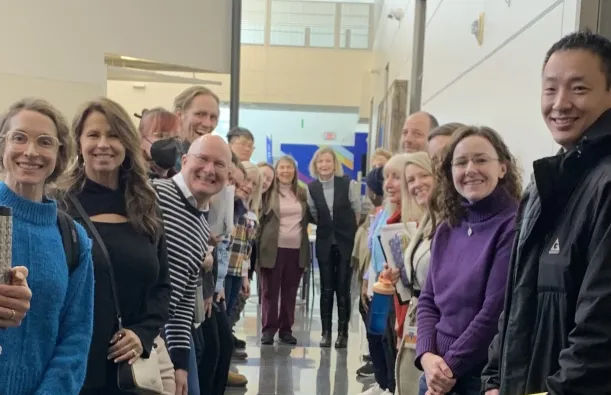 a photo of faculty posing for a picture at the January 2025 Duty Day. 