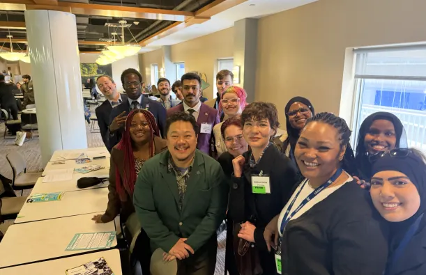 this is a photo of a group of students and a local legislator, smiling for the camera inside the Minnesota Capitol building on Advocacy Day 2026. 