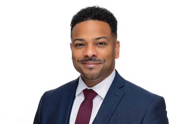 this is a professional headshot photo of Vice President of Student Affairs and Enrollment Management, Julio Vargas-Essex. 