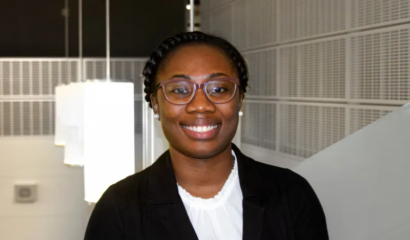 paralegal student Sehlone standing inside smiling at camera