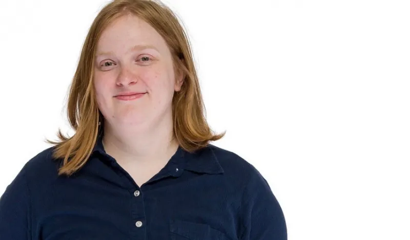 computer science student smiling at the camera 