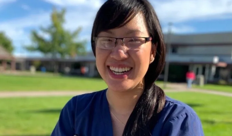 student Jessica Nguyen standing outside smiling