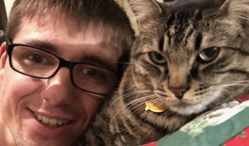 selfie of student Greg Wetzel with his cat
