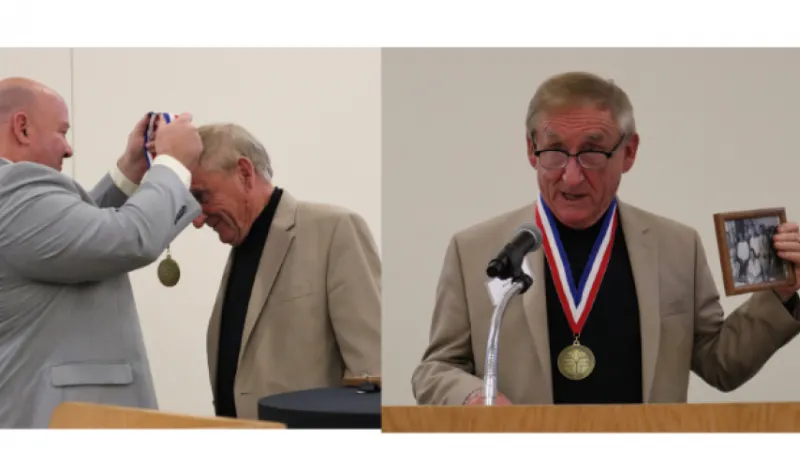 Photo of Dr. Garcia presenting the 2021 Medallion award