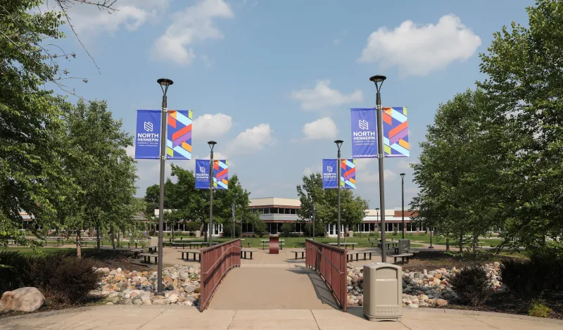 campus buildings and trees on a sunny day