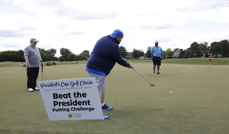 President playing golf 