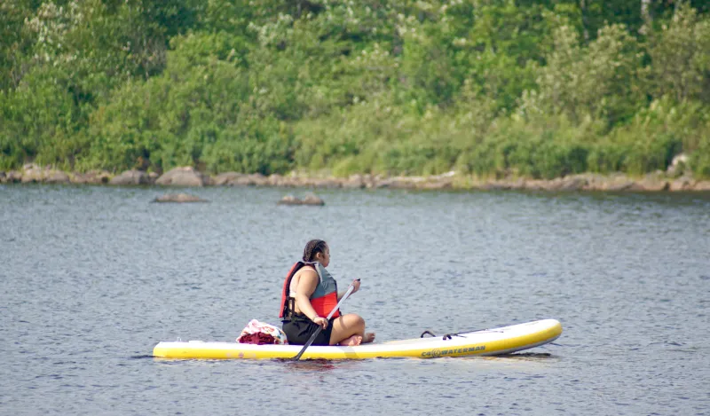 student kayaking