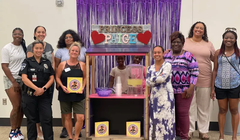 NHCC's Sista Hope 2 group with a local girl's lemonade business