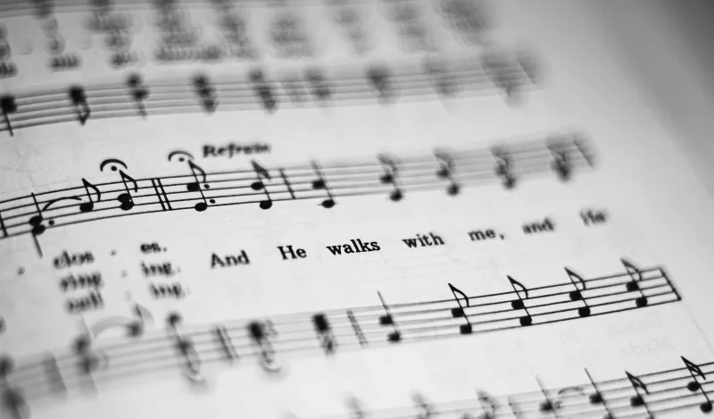 An image of sheet music with notes and words.