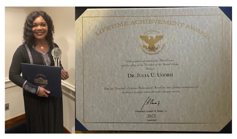 this is a photo of former dean, Julia and her Presidential award