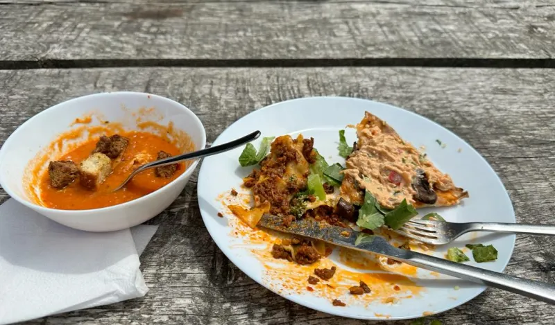 a photo of a tomato soup lunch
