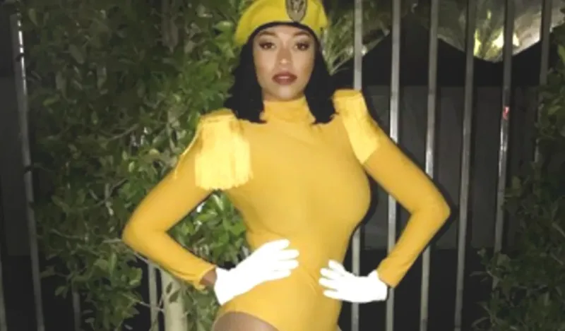 a photo of professional dancer, Corbin Hunter in the yellow backup dancer hat and outfit worn while dancing with Beyonce