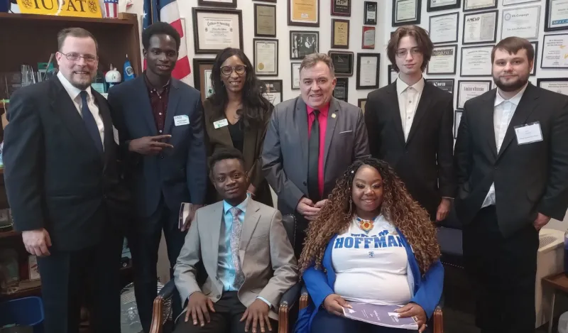 a photo of Student Senators visiting with legislators at the MN State Capitol