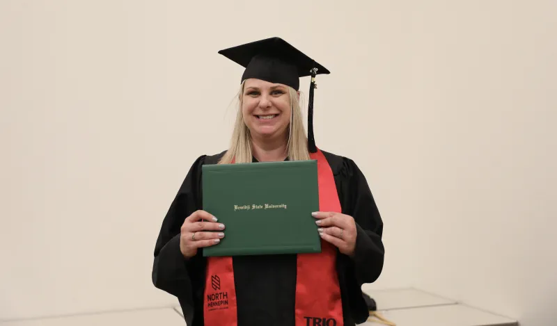 Melissa Sawyer with her BSU diploma at graduation 