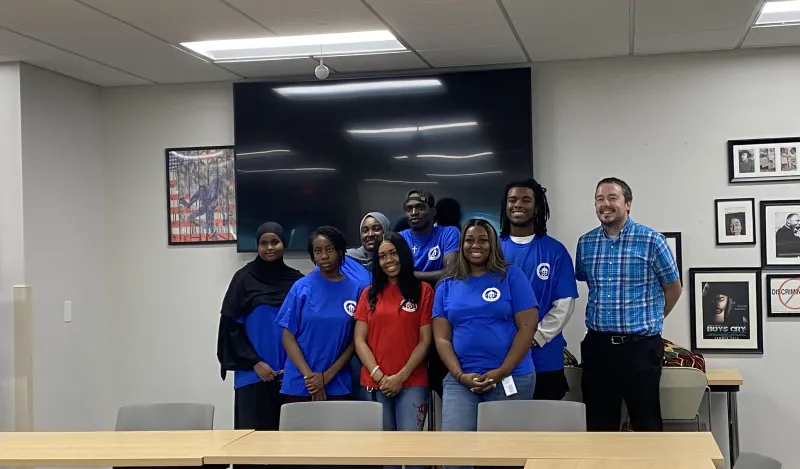 a photo of the Fall 2024 Student Senate group smiling for a photo in the Campus Center. 