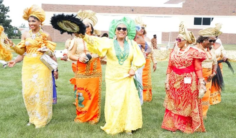 this is a photo of African women dressed in their cultural regalia, outside on the NHCC campus grass during their IgboFest Celebration event. 