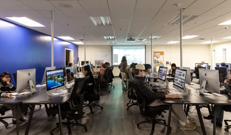 students at a computers in a classroom 