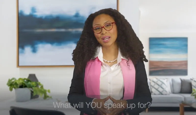 woman with glasses talking