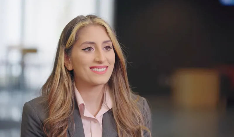 woman smiling wearing business attire 