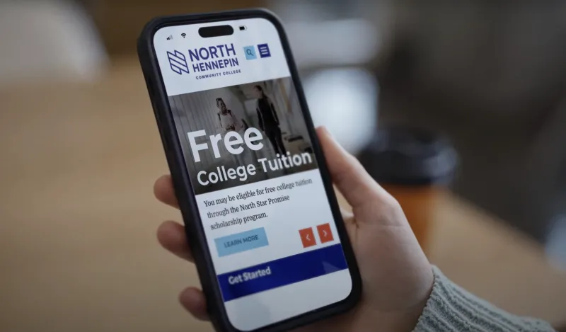 A photo of an iPhone browsing the NHCC website